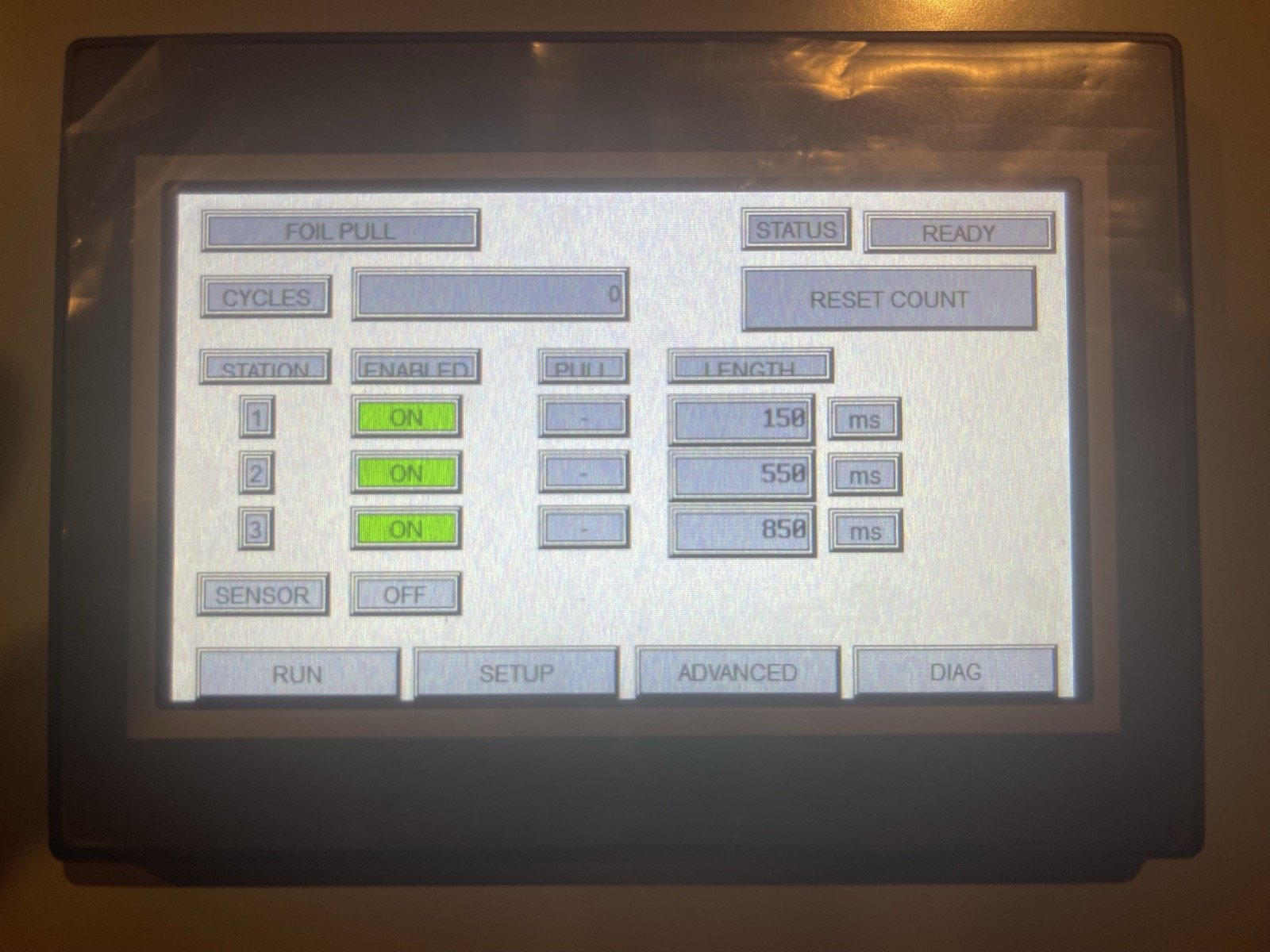 C-more Micro touchscreen showing station enables and pull lengths of 150, 550 and 850 ms